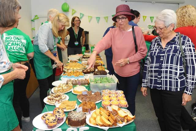 The Macmillan Information and Support Centre at Queen Alexandra Hospital is a partnership between Portsmouth Hospitals Trust and Macmillan Cancer Support. On Friday, September 27, they held their Macmillan Coffee Morning. 
Pictured is: (middle and right) Terrie Hanshaw from Gosport and Susan Barnard from Fareham, choosing their cakes.
Picture: Sarah Standing (270919-7544)