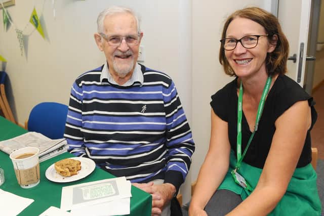 The Macmillan Information and Support Centre at Queen Alexandra Hospital is a partnership between Portsmouth Hospitals Trust and Macmillan Cancer Support. On Friday, September 27, they held their Macmillan Coffee Morning. 
Pictured is: Richard Poupart from Southsea, with Mary Harris, Macmillan Cancer Support centre manager at QA.
Picture: Sarah Standing (270919-7561)