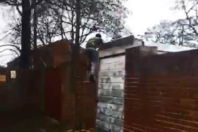 Drug dealer Michael Enzanga, 20, scales a wall after stabbing PC Russell Turner at Stamshaw Park on February 21. Picture: Hampshire police