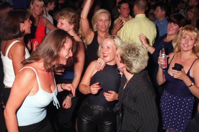 Party-goers dancing the night away at Buddies 25+ nightclub at The Pyramids Centre, Southsea in 1999.