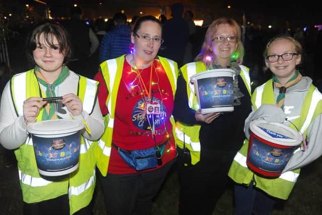 (l-r) Samantha Parkinson (11), Sarah Burt, secretary for Friends of Stockheath Common, Michelle Cockram, committee member, Trinity Ablett (12). Pictured at last year's display.

Picture: Sarah Standing (180814-8345)