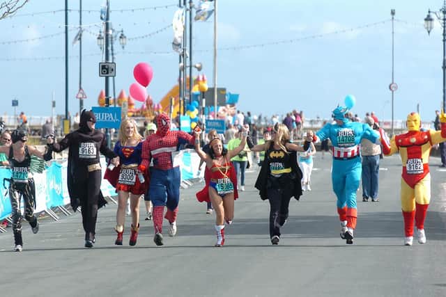 The super heroes run for the line at the end of The Great South Run 2005. Picture: Ian Hargreaves (054724-24)