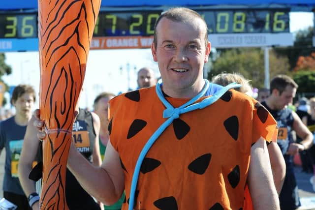 Charles Larsson dressed up as Fred Flintstone at the 21st Great South Run in Southsea on Sunday 24th October 2010. Picture: Sarah Standing (103427-760)