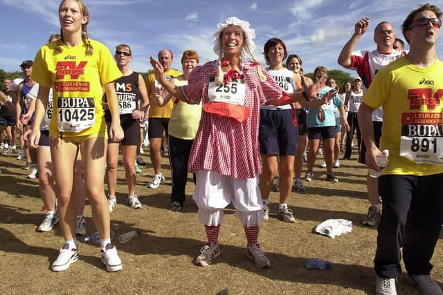 Debbie Pentland (43) from Portsmouth who teaches exercises to the elderly and children with special needs does her pre-race exercises in 2002. Picture: Malcolm Wells (024605-16)