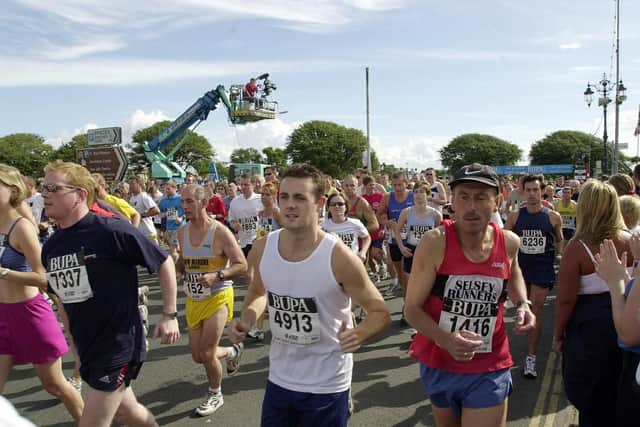 Runners taking part in this years BUPA Great South Run in 2002. Picture: Malcolm Wells 024605-46