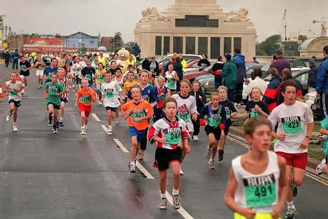 Competitors in the Junior Fun Run head towards the finish line.  Action from the Great South Run in 1999. (994689-6)