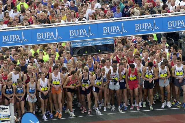The elite front runners check their watches just before the start of the BUPA Great South Run 2004 event at Clarence Esplanade, Southsea. Picture: Michael Scaddan (044970-0313)