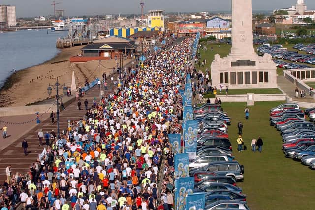 Runners taking part in the BUPA Great South Run 2005 at Southsea, pictured after the start near the Blue Reef aquarium, making their way along Clarence Esplanade, Southsea. Picture: Michael Scaddan (054668-0191)