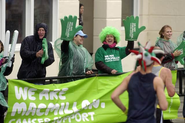 Great South Run. Supporters cheer on the runners in 2007. Picture: Will Caddy (074358-23)