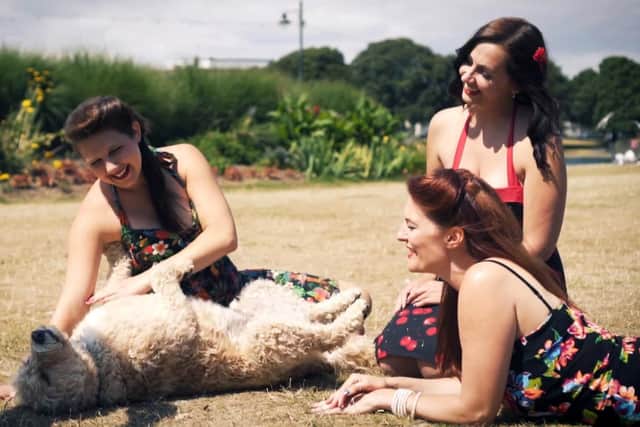 Chloe is left stroking the dog, Lauren in the middle and Lindsey on the right.
Picture: Matt Brook