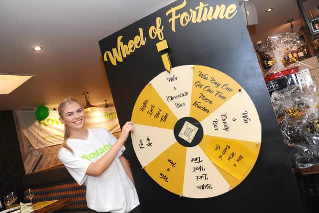 Waitress Millie Warwood with the Wheel of Fortune
Picture: Sarah Standing (101019-8678)