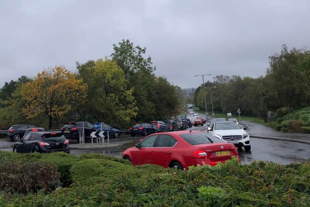 Traffic leaving the Asda car park on Larchwood Avenue