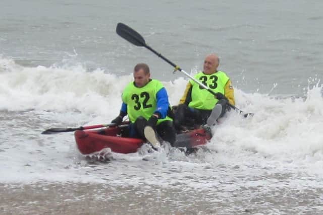 Baz Marsh and son Lewis land at the rest station at the Inn on the Beach during the Hayling Round the Island Kayak Event 2019