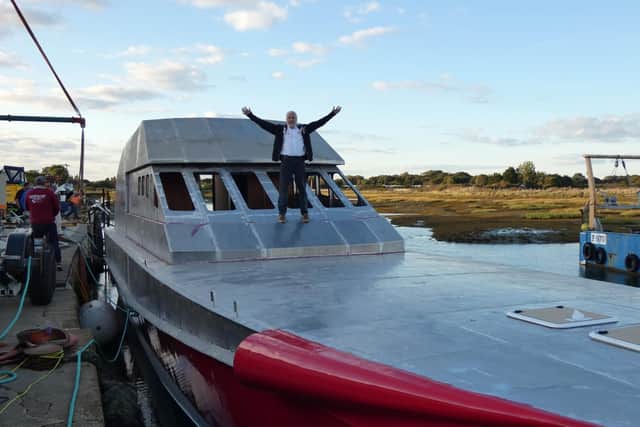 Team Britannias round the world superboat Excalibur has hit the water for the first time at a boatyard at Hayling Island. Pictured is Alan Priddy on the boat. Picture: Team Britannia
