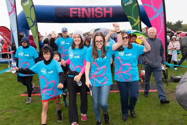 The Alzheimer's Society called on family, friends and colleagues to unite against dementia by joining the Memory Walk. Hannah Woods (centre right) leads off the Memory Walk.
Picture: Duncan Shepherd