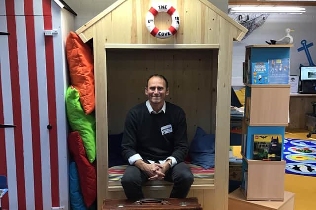 Author, Mark Robertson, at the school's new library.