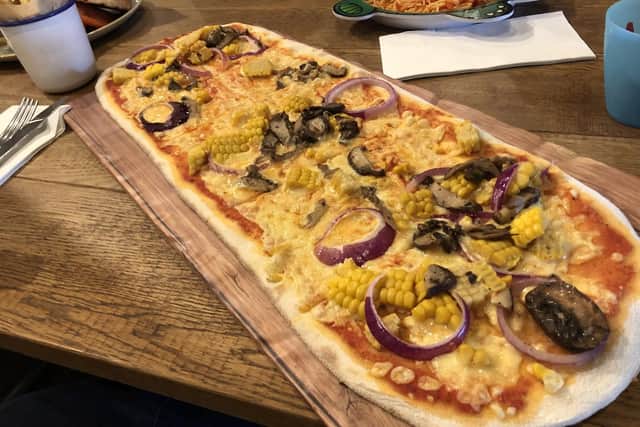 The large mushroom and grilled sweetcorn pizza, with cherry bell peppers, red onion, thyme.