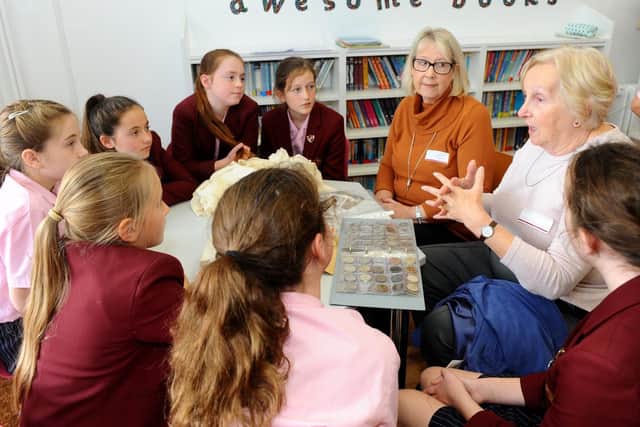 Year 6 pupils listen with interest to what life was like in the 1950's.
Picture: Sarah Standing (171019-9425)