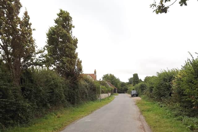 NOW: Church Lane, Warblington, with a Jeep parked where the ditch once ran.