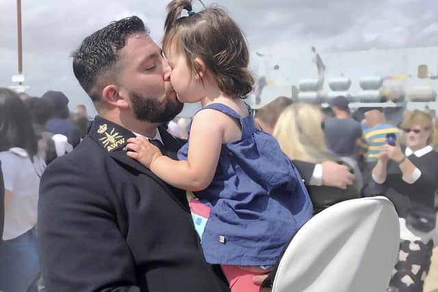 Eleanor Owen giving her Dad, Chief Petty OfficerJames Owen, a big welcome home hug following his longdeployment serving on HMS Westminster.