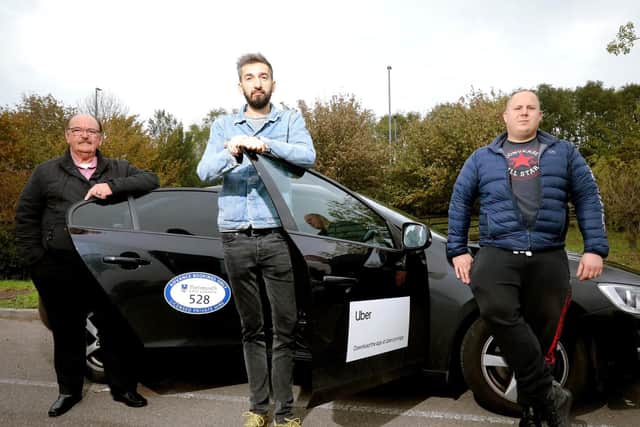 Cab drivers, from left, Peter Sutherland, Peter Ballateanu and Tamas Bodolai Picture: Chris Moorhouse  (231019-13)