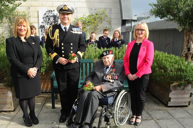 From left, Ally Davies, visit and events manager and Poppy Appeal Organiser for Portsmouth Naval Base, Commodore JJ Bailey, commander of Portsmouth Naval Base with Polish veteran Colonel Otton Hulacki and Claire Baverstock, general manager of the Submarine Museum. Picture: Sarah Standing (251019-185)