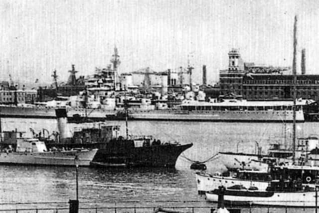 An enlargement of the picture above showing the battleship/battlecruiser. Can anyone identify her? Picture: Ian Wilding collection.