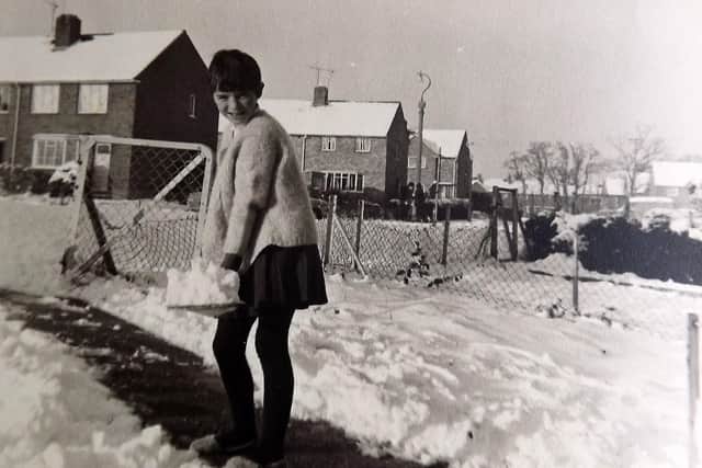 Can anyone tell me where in Leigh Park this 1963 winter photograph might have been taken or who the girl is? Photo: Barry Cox collection.