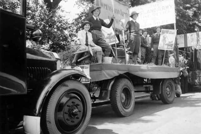 Roll up, roll up and join the Womens Land Army. Girls on a recruitment drive in Southsea. Picture: Mick Cooper collection.