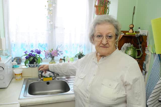 Sylvia McCord, 80, has been having to boil water in a pan to use for washing.

Picture: Sarah Standing