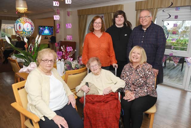 Doris Huzinga, front middle, with her family, from left, niece-in-law Carol Hellyer, great-nephew Craig Hellyer, and nephew Kevin Hellyer, with sister-in-law Shirley Hellyer, front left, and niece Nicky Hellyer. Picture: Sarah Standing (311019-761)