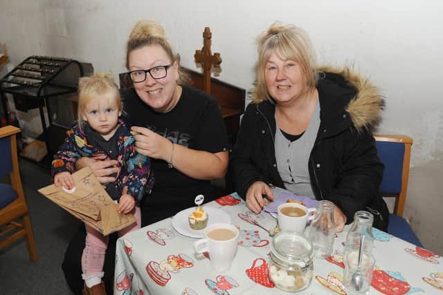Mums Unite held their first coffee morning across the UK on Friday, November 8. The Mums Unite group in Gosport held their coffee morning at St. Thomas the Apostle Church in Elson, raising money for Pregnancy Sickness Support.Pictured is: (left) Tara Hall (36) from Fareham, with her daughter Faith Hickmott (1) and mum Maria Richardson (59) also from Fareham.Picture: Sarah Standing (081119-1397)
