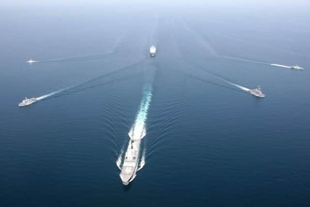Royal Navy ship HMS Defender and Royal Fleet Auxiliary ship RFA Cardigan Bay anchor a formation of coalition mine countermeasures and maritime security vessels at sea, operating in support of the International Mine Countermeasures Exercise (IMCMEX). IMCMEX includes navies from more than 30 countries spanning six continents training together across the Middle East. The exercise is focused on maritime security from mine countermeasures, maritime infrastructure protection and maritime security operations in support of civilian shipping (photo courtesy of Royal Navy/Released)