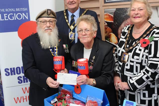 Pictured in 2015 is Chairman Havant branch The Royal British Legion, Dave Argue, Mayor's consort Andy Cousins, Olive Rush poppy appeal organiser, and then-Mayor of Havant Cllr Leah Turner. 
Picture: Allan Hutchings (151754-399)