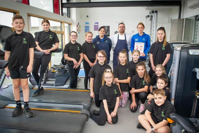 Steven Cross with Park Community School pupils in sports gear.
Picture: Habibur Rahman