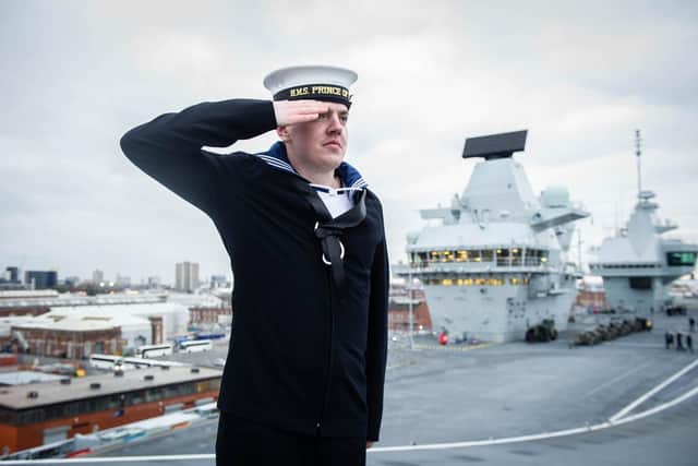 Engineering Technician Bardwell salutes on the flight deck of HMS Prince of Wales after she arrived in Portsmouth. 
Picture: Habibur Rahman