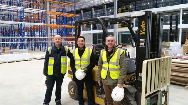 Havant MP Alan Mak with FatFace chief executive Anthony Thompson and infrastructure director Simon Ratcliffe