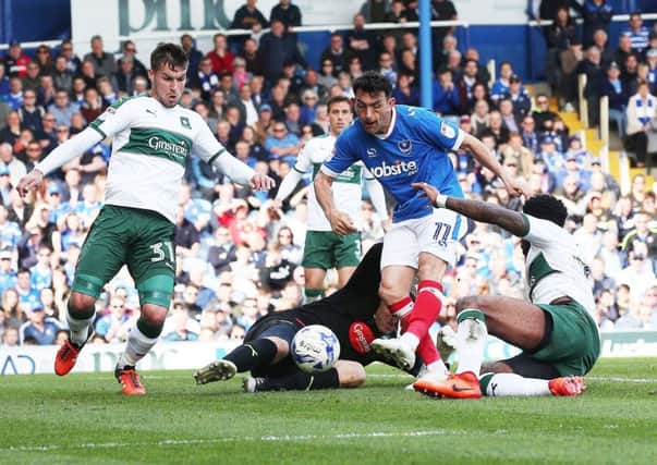 Gary Roberts scores against Plymouth at Fratton Park back in April Picture: Joe Pepler