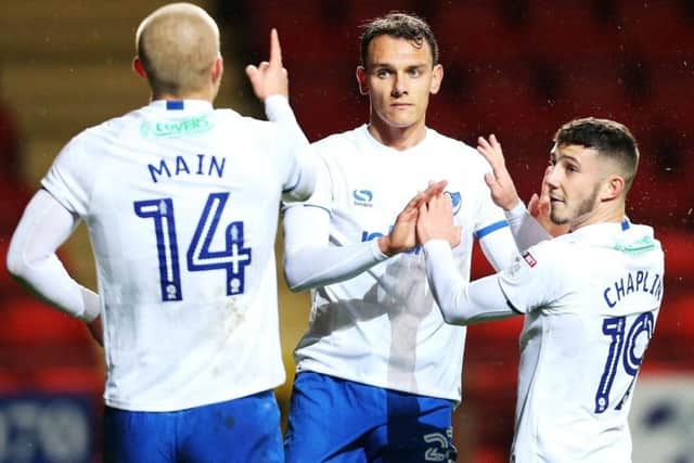 Curtis Main celebrates his winner against Charlton in the Checkatrade Trophy with Kal Naismith and Conor Chaplin. Picture: Joe Pepler
