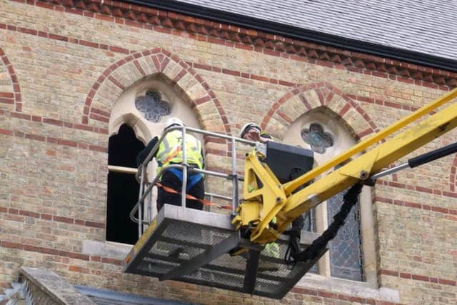 Work on the crumbling window frames at St Simons Church, Southsea