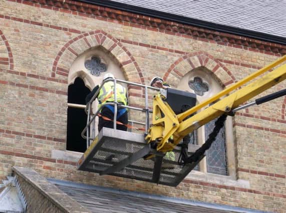 Work on the crumbling window frames at St Simons Church, Southsea