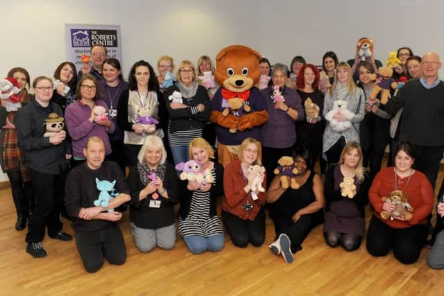 Staff from The Roberts Centre joined together at Landport Community Centre to mark the launch of the 'Find Robert The Bear' Competition. The aim is for people to take photos of their bears in interesting parts of the Portsmouth/Gosport/Fareham/Havant/Waterlooville areas.
Picture: Sarah Standing (170129-1543)