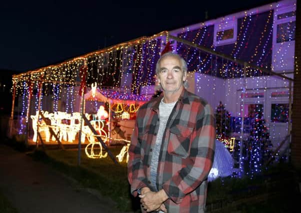Dave Watson pictured outside his lit up home.

Picture: Habibur Rahman