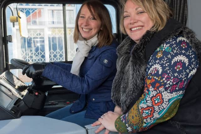 Joanne Vines and Sammy Ellen at the wheel of the bus.  Picture: Keith Woodland