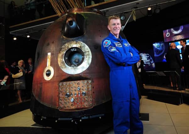 Tim Peake with the Soyuz spacecraft at the National Science and Media Museum in Bradford