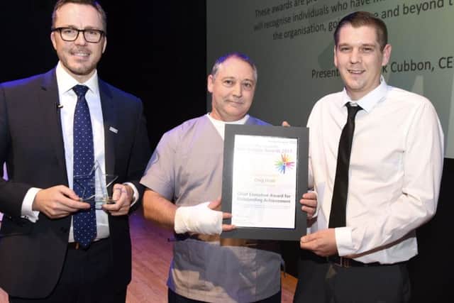Craig Dodd, right, with Jose Amorim, whose life he saved, and, left, Mark Cubbon, chief executive of Portsmouth Hospitals NHS Trust