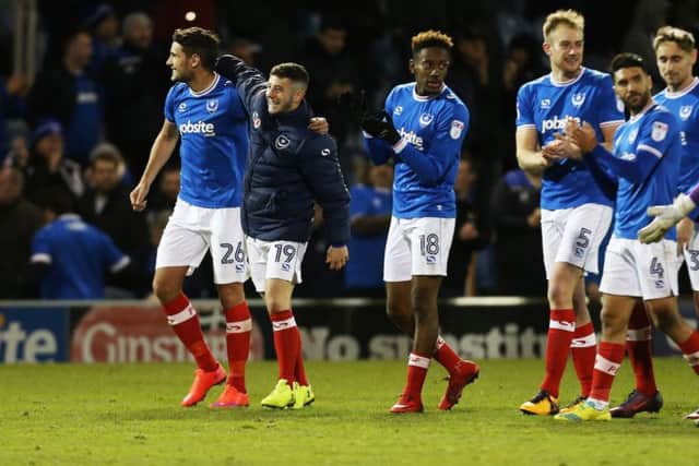 The Pompey players celebrate their 1-0 victory over Plymouth