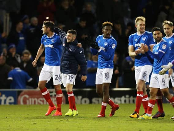 The Pompey players celebrate their 1-0 victory over Plymouth