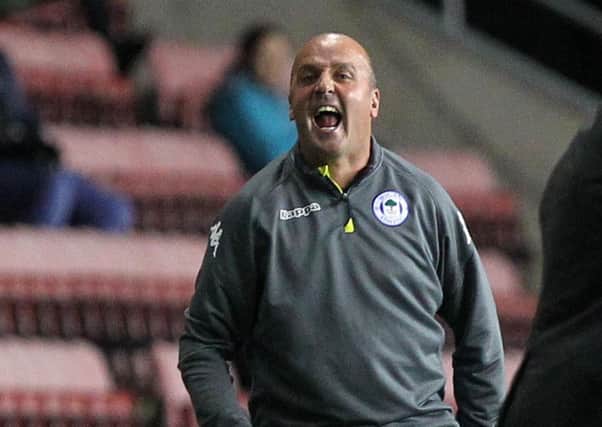Former Pompey boss Paul Cook guided Wigan Athletic back to the top of League One