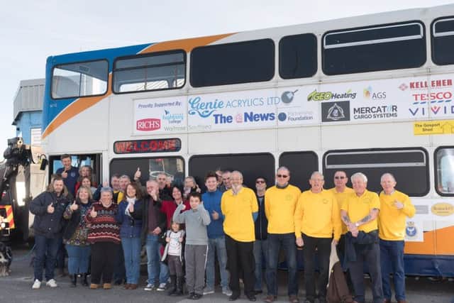 Some of the many volunteers and sponsors alongside the bus.

Picture: Keith Woodland